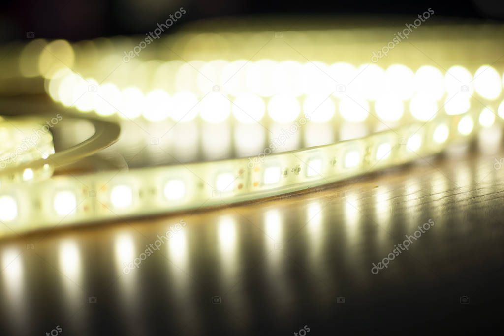 decorative beautiful shine light from LED diode strip background out of focus 