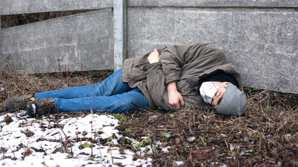 death from the Chinese epidemic of coronavirus. a guy in a protective medical mask lies dying from a virus. Ncov-2019