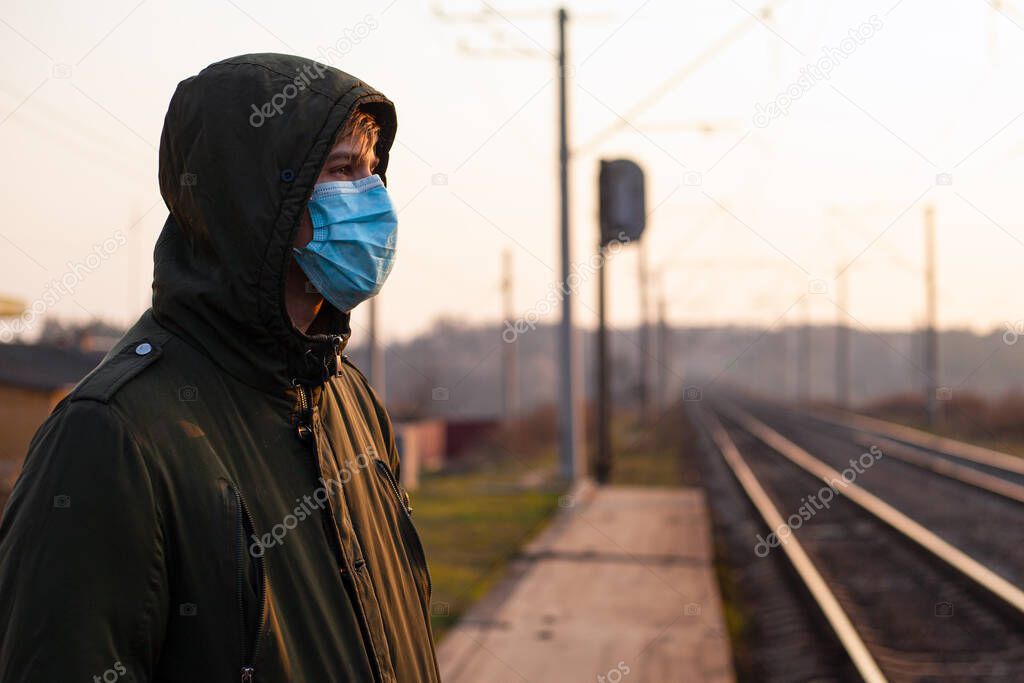 respiratory disease coronavirus in Russia, Ukraine. man in a medical mask on the platform. pandemic quarantine  