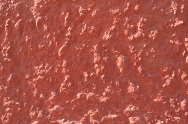 Güneşli bir dokulu ve sıvalı duvar