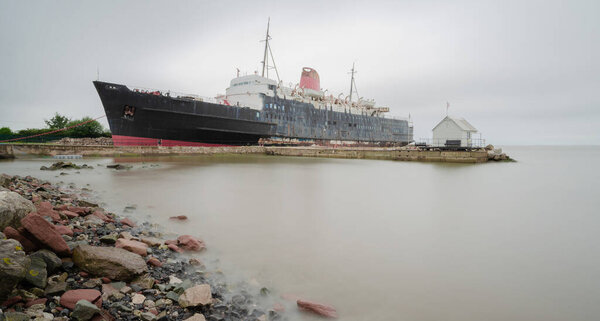 Llanerch-y-Mor, UK : Jul 31, 2019: Passenger ferry steam ship, TSS Duke of Lancaster operated from 1956 to 1979. It was then permanently beached to operate as a tourist attraction & is now abandoned.