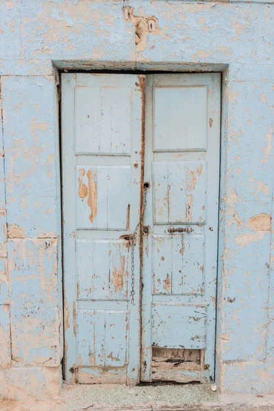 Traditional old painted door in a historical district or medina, Tunisia.