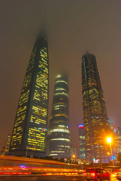 Light trails on the modern building background in Shanghai, China. — Stock Photo, Image