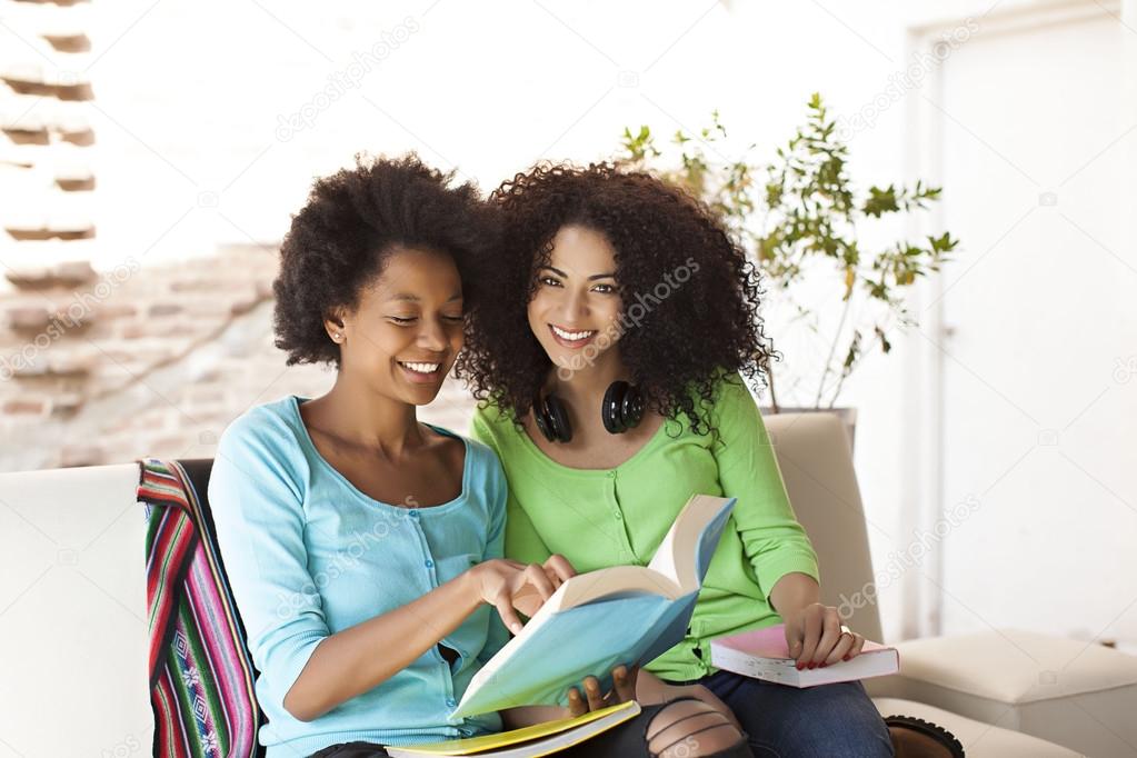 African american friends reading book