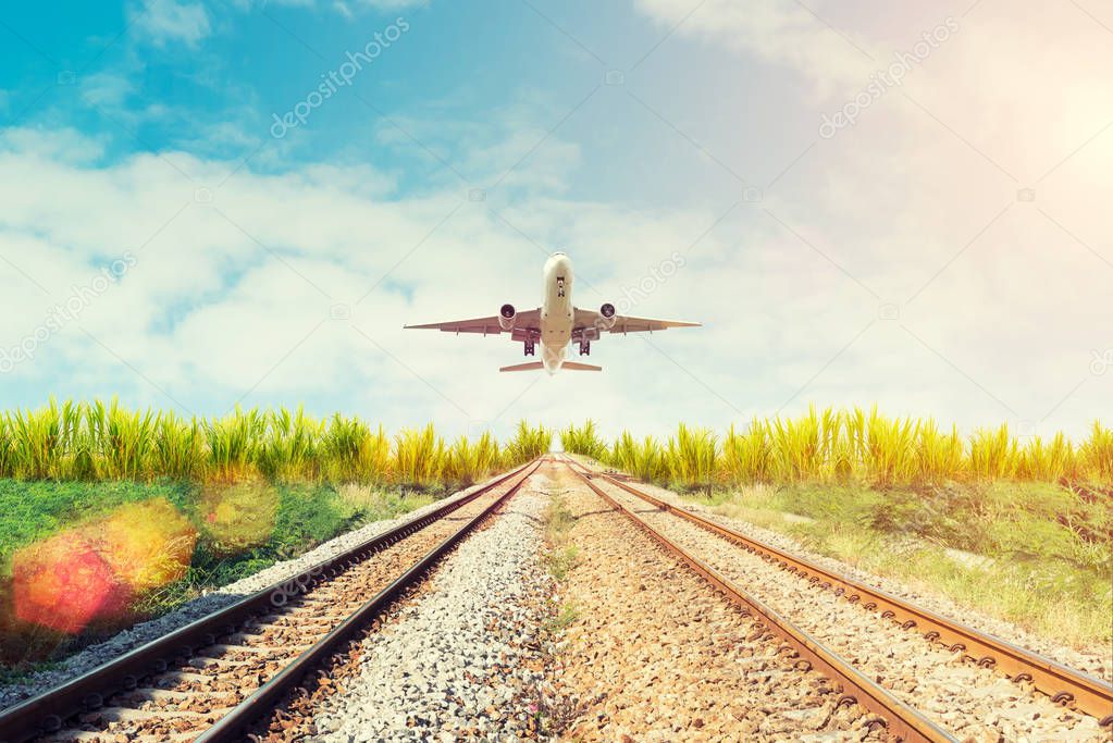 Airplane and railway at sunset. Travel or Transporttation backgr