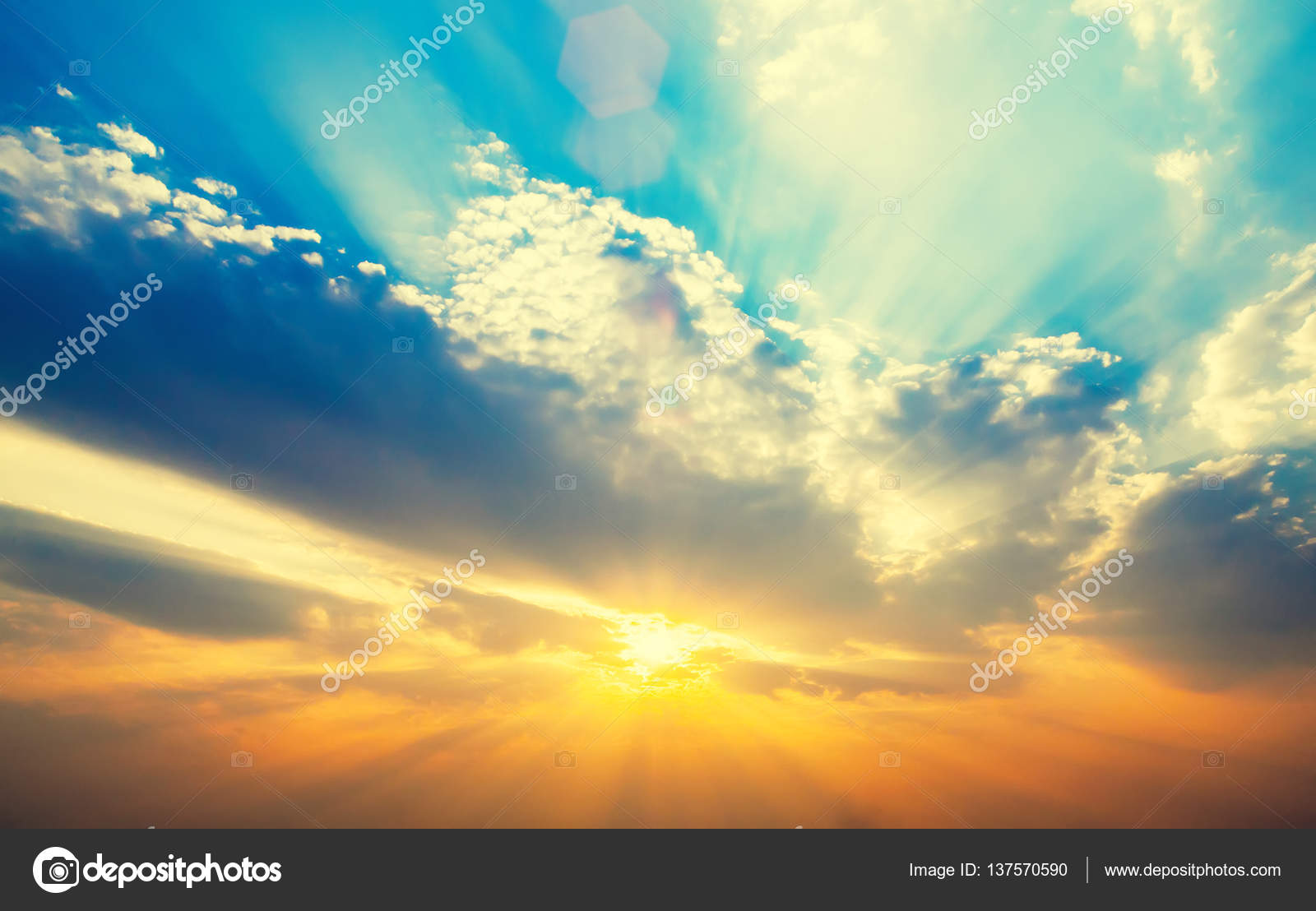 Beautiful sunset sky with sun rays. Nature background. Stock Photo by  ©tawanlubfah 137570590