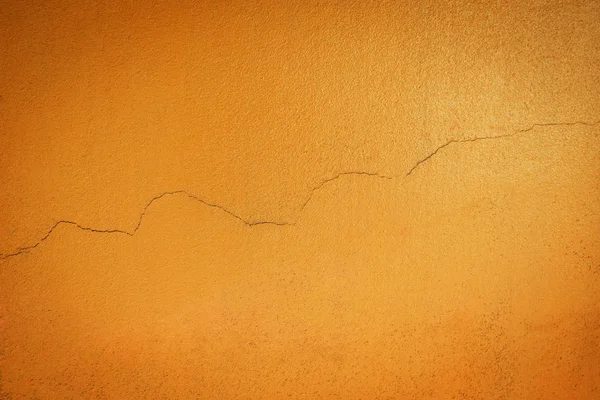 Sfondo arancio texture parete con grunge e crack. Riassunto b — Foto Stock