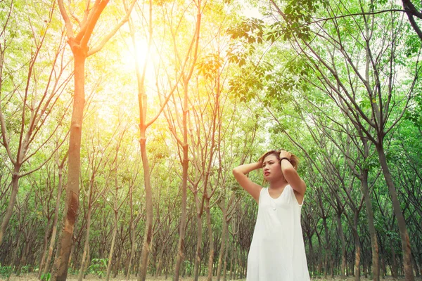 Sad unhappy woman in the green forest, stress, depression — Stock Photo, Image