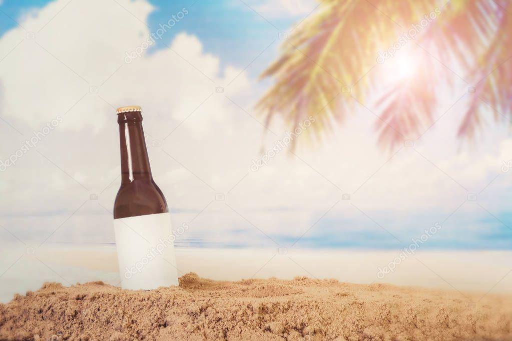 Blank Logo Beer bottle in the sand with beach background