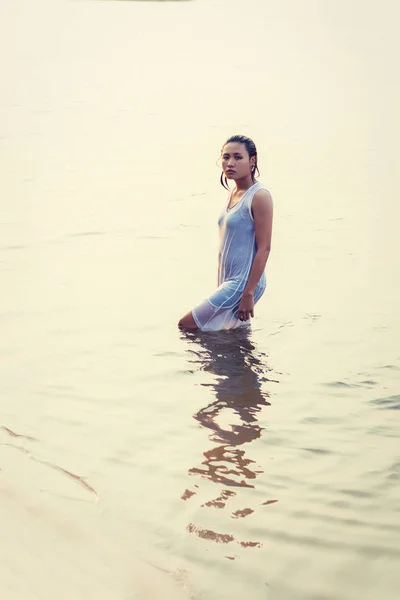 sad woman alone in the pond