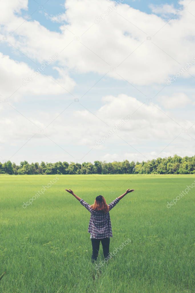 Freedom Young beautiful woman stretching her arms into the sky e