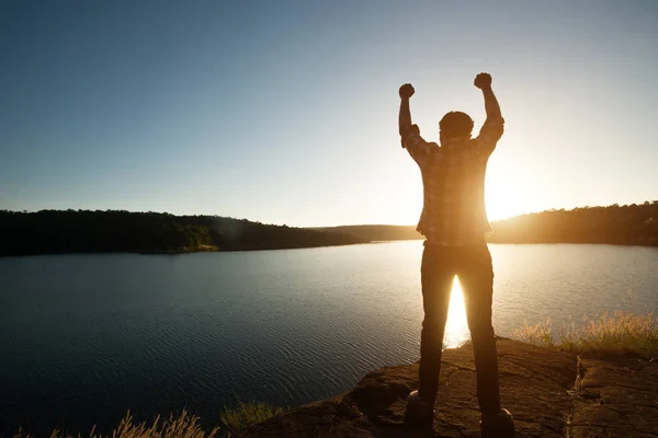 Hiker man winner silhouette on the mountain top. Sport and activ — Stock Photo, Image