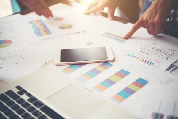 Business people at work on stock market charts in office. Meetin — Stock Photo, Image