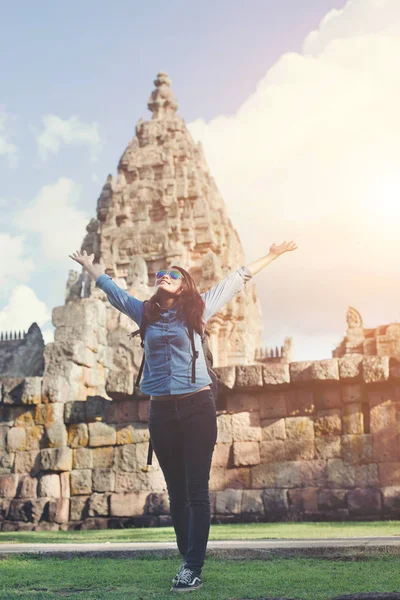 Young attractive woman enjoy life while traveling at phnom rung