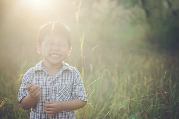 Happy little asian boy playing outdoors. Enjoy life. Cute asian — Stock Photo, Image