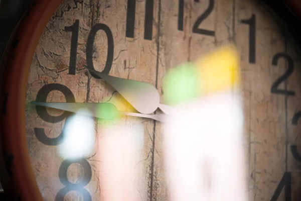 Close up of hands on vintage clock face — Stock Photo, Image