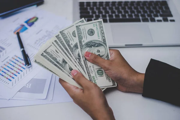 Business woman with dollars, close up sitting on her workplace w — Stock Photo, Image