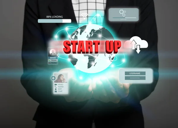 Businessman pressing business start-up button on virtual screens