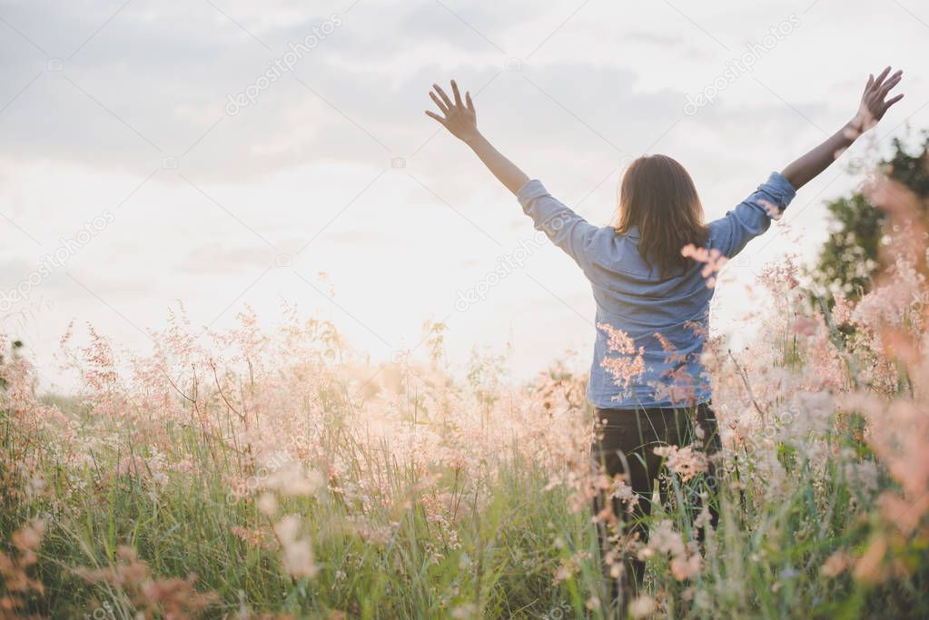 Young beautiful woman standing stretch her arms in the air on th