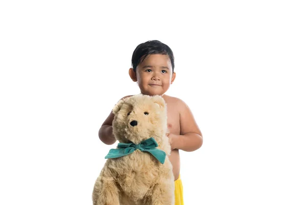 Little asian boy holding big teddy bear, isolated on white backg — Stock Photo, Image