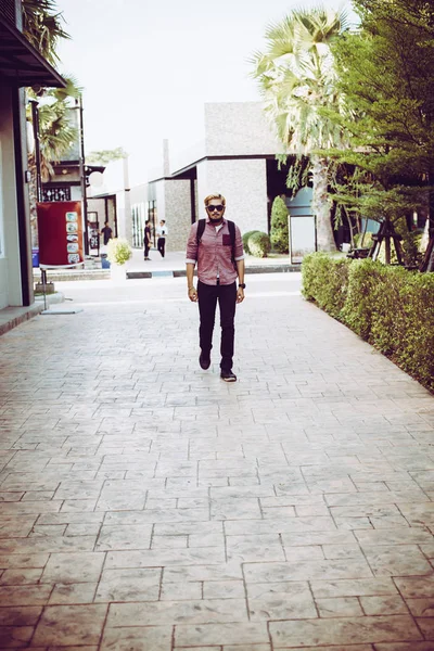 Portrait of handsome hipster man in jeans clothes and sun glasse — Stock Photo, Image