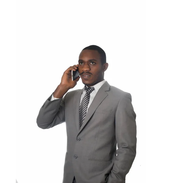Ung entreprenör talar i mobiltelefon isolerad på vit. — Stockfoto