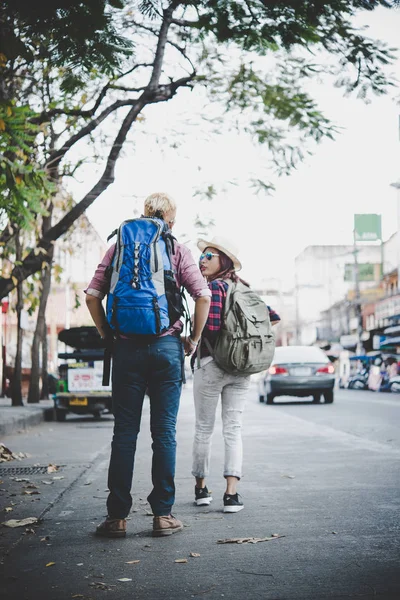 Travel couple walking around city on vacation having fun. Couple on holiday.