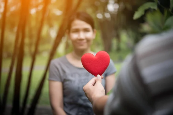 Young Man Holding Heart Shaped Valentine Card Looking While Standing — Stock Photo, Image