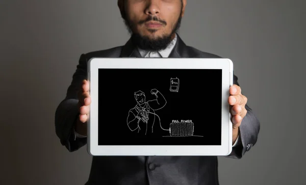 Businessman holding tablet pc with business doodle icon interface on her hand conceptual image of business