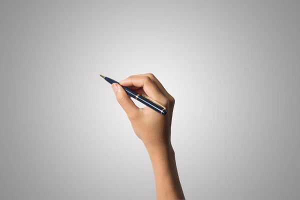 Woman hand with pens isolated on white background.