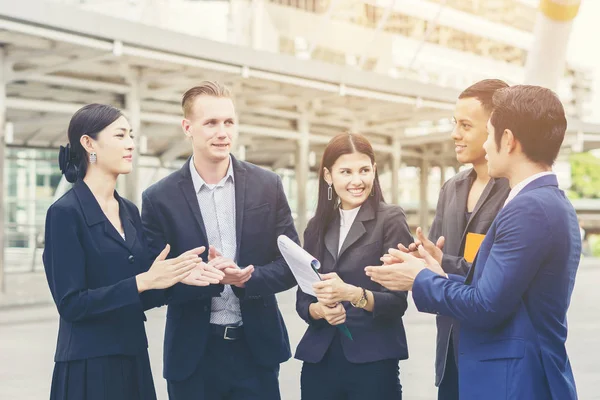 Portrait Group of business people conversation at meeting outside. Business concept.