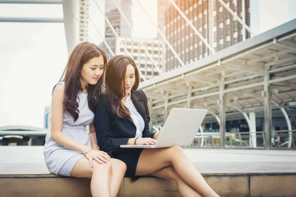 Business woman talking or Conversation while working sitting  Outdoor.