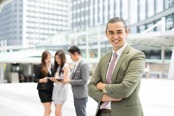 Portrait of Businessman standing against the building outdoors