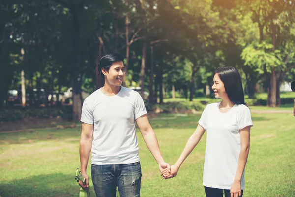 Young Couple Holding Hands Walking Away Together — Stock Photo, Image