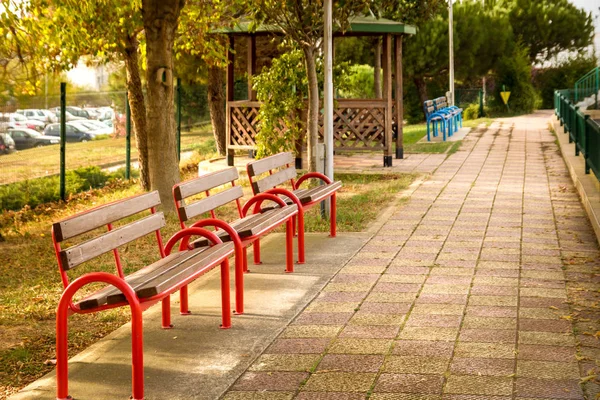 Beautiful park with pathway, arbors and benches in yellow autumn — Stock Photo, Image