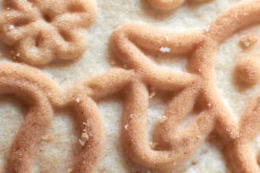 Arkaplan, desenli kurabiyeler yakın plan (makro) lezzetli hamur işleri.