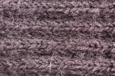 Fotoğraf gri kumaş yakın çekim (makro), büyük bir örgü süveter gösterir
