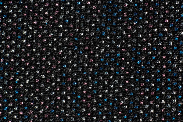 Textur av mörkt tyg med strass, pärlor. Närbild (makro)). — Stockfoto