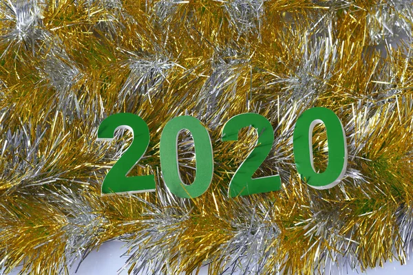 Green inscription 2020, new year as a holiday symbol, design for postcard.