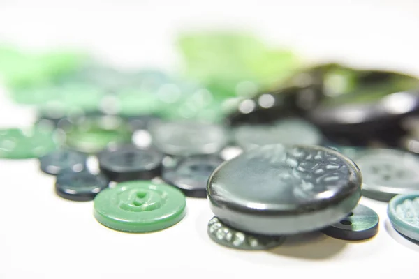 Green buttons of different shape and size on the white backgroun — 스톡 사진