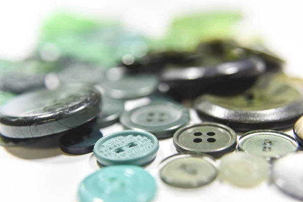 Green buttons of different shape and size on the white backgroun — 图库照片