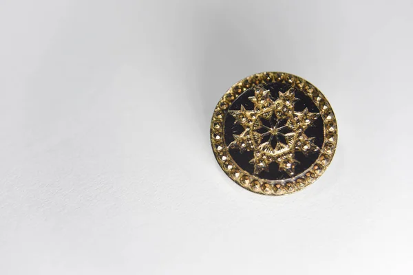 Black and golden ornamented button with floral mandala pattern o — ストック写真
