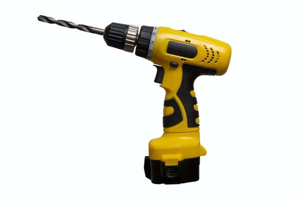 Yellow cordless drill with a drill isolate on a white background — 스톡 사진