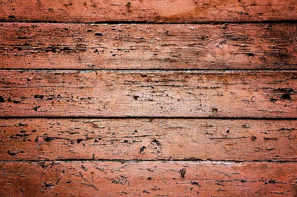 旧的木制背景 有裂缝 板子上覆盖着红色的旧底漆 木板上剥皮油漆的质地 旧木地板 — 图库照片