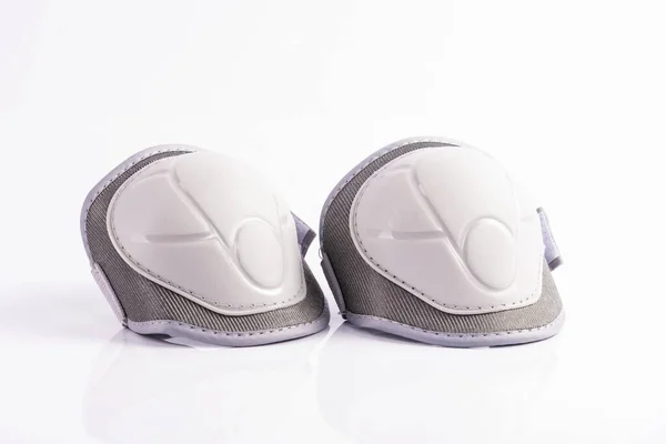 White children\'s knee pads on a white background