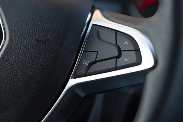 Voice control button on the steering wheel of a modern car — Stock Photo, Image