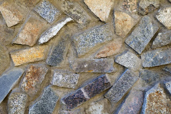 不同颜色、砖和混凝土的石头的结构 — 图库照片