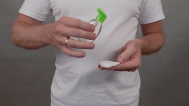 Disinfection of the phone with a sanitizer, a man rubs the phone with a napkin — Stock Video