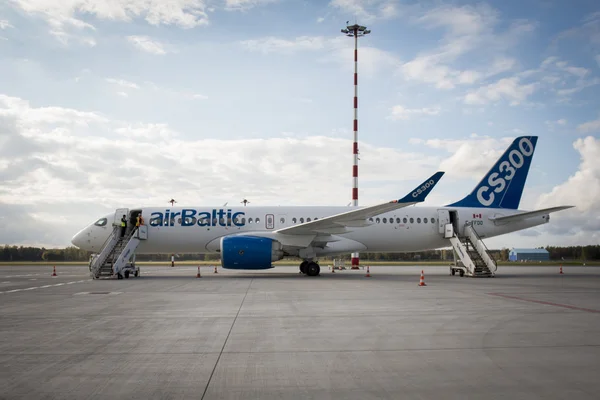 RIGA - SEPTEMBER 27: airBaltic new Bombardier CSeries passenger jet on display at Riga Airport - September 27, 2016 in Riga, Latvia — Stock Photo, Image