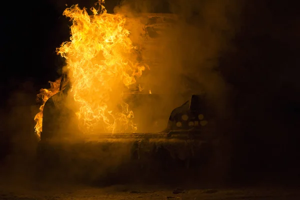 Burning car on the road in night — Stock Photo, Image